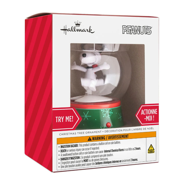 Hallmark Peanuts Snoopy musical snow globe Christmas ornament with swirling snow, festive holiday music, motion, and hanger attachment.