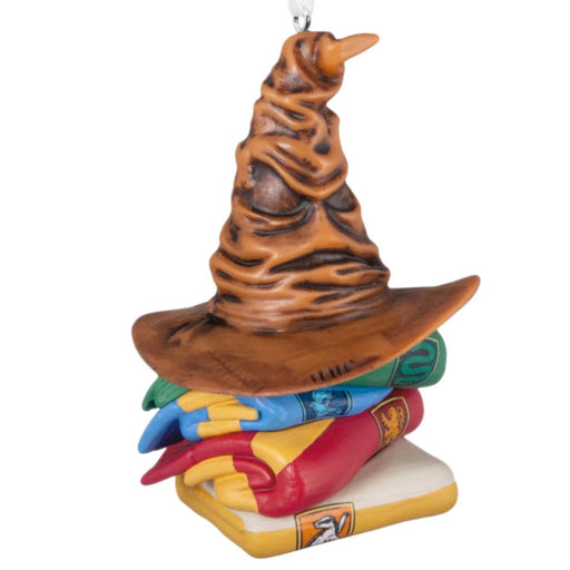 Hallmark Harry Potter Sorting Hat and Hogwarts house scarves ornament featuring the iconic Sorting Hat with Gryffindor, Hufflepuff, Ravenclaw, and Slytherin colors, collectible Christmas tree decoration.