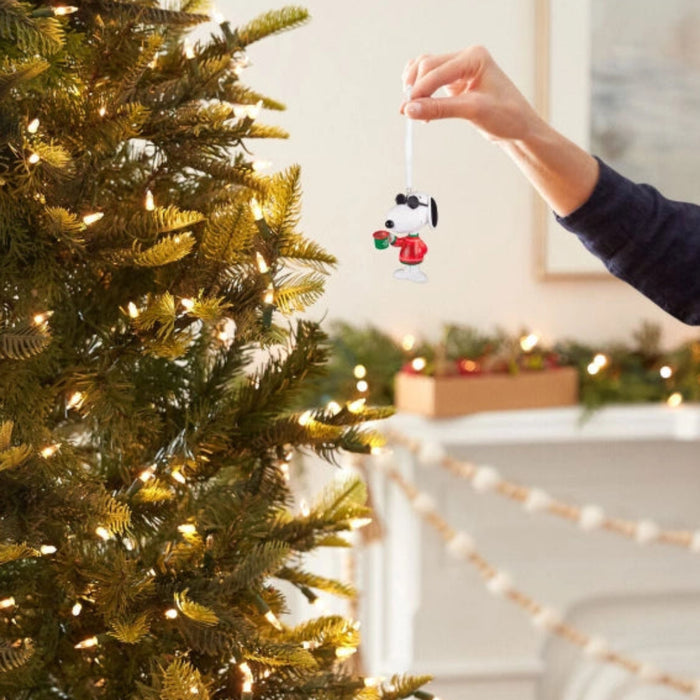 This Hallmark Peanuts® Festive Joe Cool Hallmark Ornament brings the timeless charm of Snoopy's famous Joe Cool persona to your holiday décor.