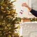 This Hallmark Peanuts® Festive Joe Cool Hallmark Ornament brings the timeless charm of Snoopy's famous Joe Cool persona to your holiday décor.