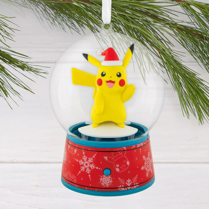 Hallmark Pokémon Pikachu musical snow globe Christmas ornament with swirling snow, holiday music, hanger attachment, and interactive motion.