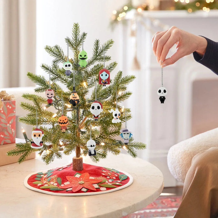 Hallmark Disney Tim Burton’s The Nightmare Before Christmas countdown calendar with 12 miniature shatterproof character ornaments, each 1.75 inches high with hanger attachments.