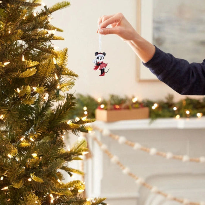 This Hallmark Disney Minnie Mouse Festive Hallmark Ornament brings classic Disney charm and holiday cheer to your Christmas décor. 