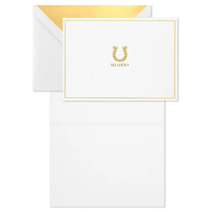 White card with gold text and envelope on a white background