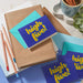 Blue cards with 'high five!' text on a desk with stationery items