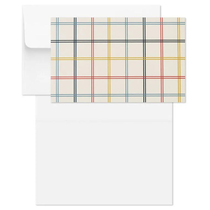 Plaid patterned paper and envelope on a white background