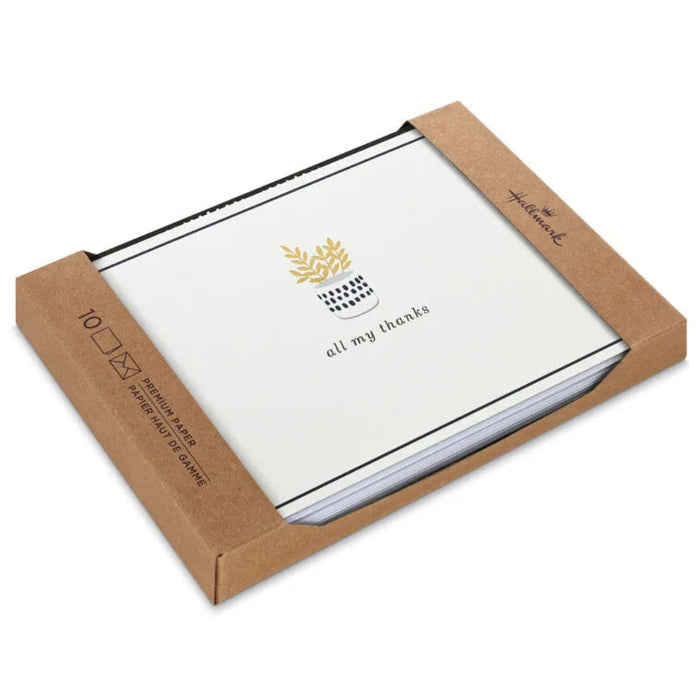 Set of greeting cards with 'all my thanks' text and a logo, in a brown cardboard box.