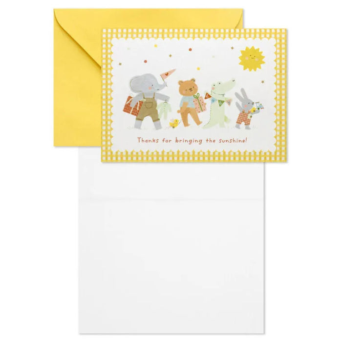 Greeting card with cartoon animals and a yellow envelope on a white background