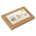 Card with cartoon animals and a sun, inside a brown cardboard box