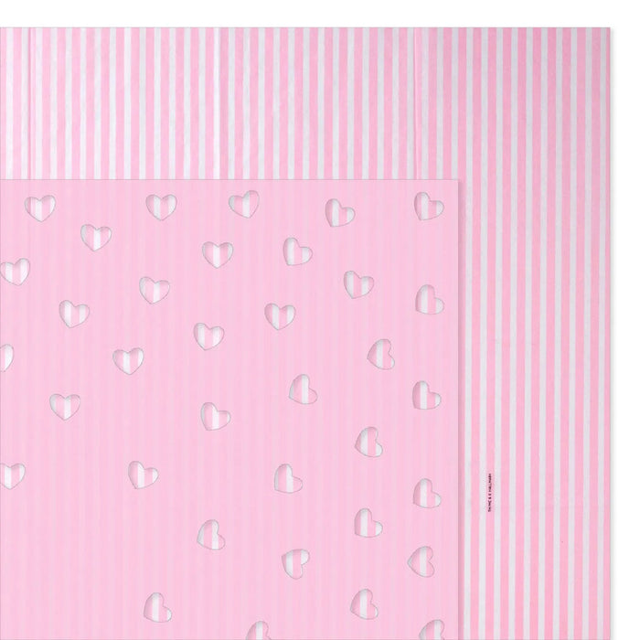 Close‑up of pink striped and heart‑cutout tissue paper