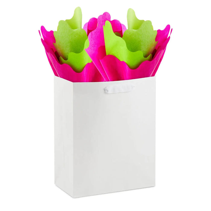 Fuchsia and green wavy‑edge tissue in a gift bag