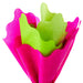 Vibrant fuchsia and green tissue with wavy edges styled in a cone shape