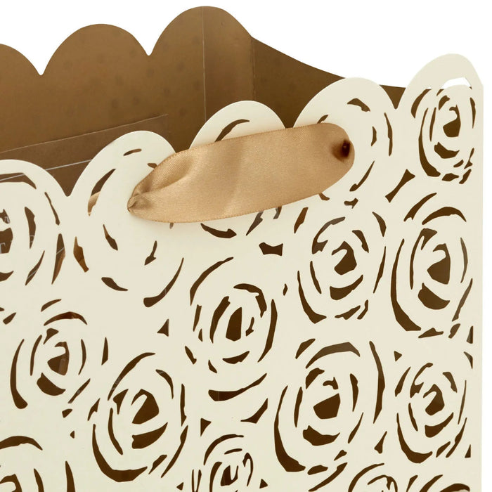 Cream Hallmark gift bag with gold interior and laser-cut roses