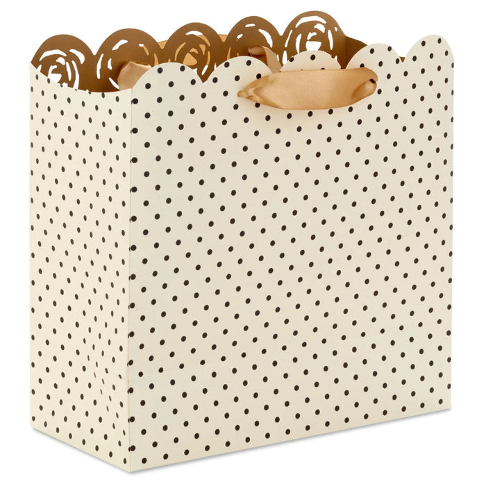 Cream Hallmark gift bag with gold interior and laser-cut roses