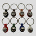 Set of keychains with metal bells on a white background