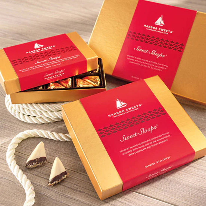 Sailboat shaped almond buttercrunch toffee covered with white chocolate and dipped in dark chocolate and pecan spindrift.