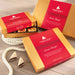 Sailboat shaped almond buttercrunch toffee covered with white chocolate and dipped in dark chocolate and pecan spindrift