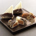 Sailboat shaped almond buttercrunch toffee covered with white chocolate and dipped in dark chocolate and pecan spindrift