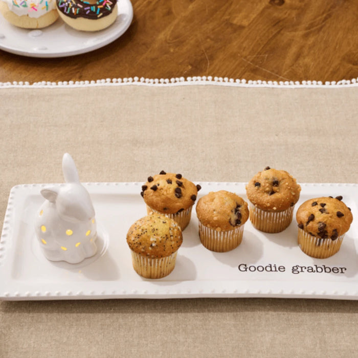  A charming white ceramic bunny featuring vibrant polka dots, perfect for spring or festive decor.