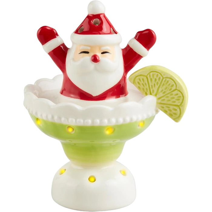 Decorative figure of Santa Claus with a lime wedge on a white background