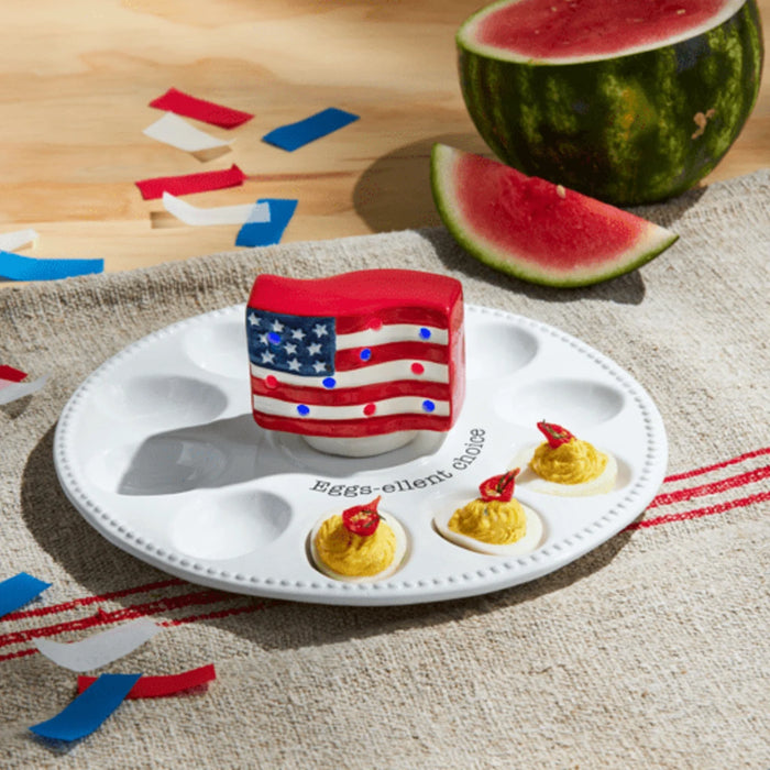 A ceramic lamp adorned with a patriotic flag motif, highlighting vibrant red, white, and blue elements.