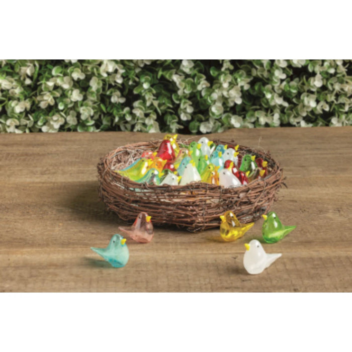 A decorative bird nest brimming with vibrant glass birds, featuring a spectrum of colors and artistic details.