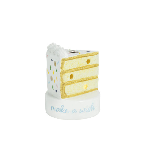 A single candle placed on top of a slice of cake, ready for a celebration.