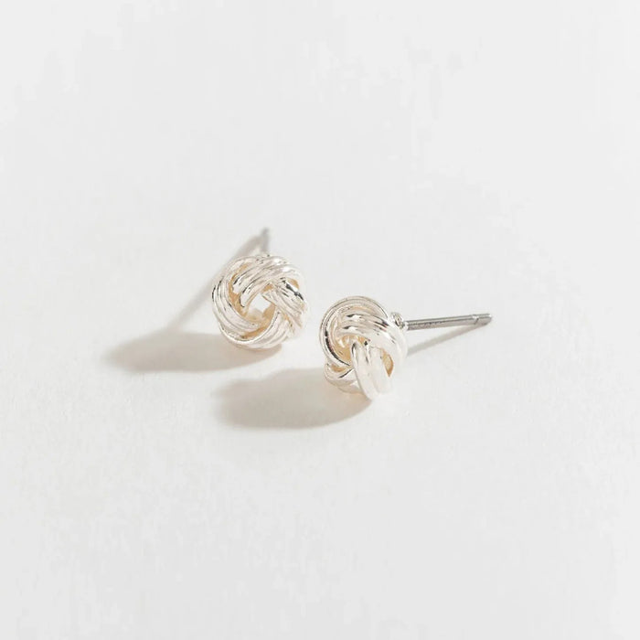 Howards Inc Silver Love Knot Ear Sense Earrings featuring a classic silver-tone love knot design with hypoallergenic Ear Sense posts, lightweight comfort, and elegant styling for sensitive and pierced ears.