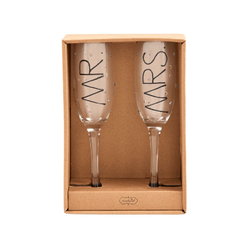 Two champagne flutes labeled "Mrs" and "Ws," elegantly arranged for a celebration.