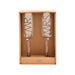 Two champagne flutes labeled "Mrs" and "Ws," elegantly arranged for a celebration.