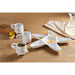 A star-shaped dish in white with a decorative gold star accent.