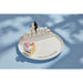 A white plate with the inscription "Celebrate Everything" artistically arranged.