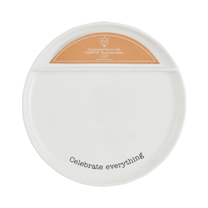 A white plate featuring the phrase "Celebrate Everything" in elegant lettering.