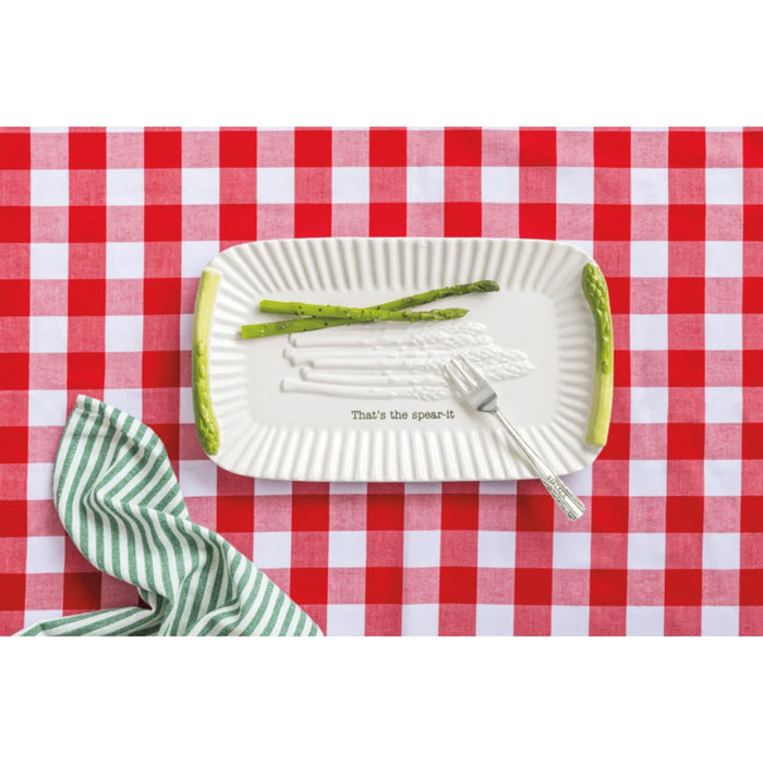 A white plate featuring a fork and knife arranged on it, symbolizing dining readiness.
