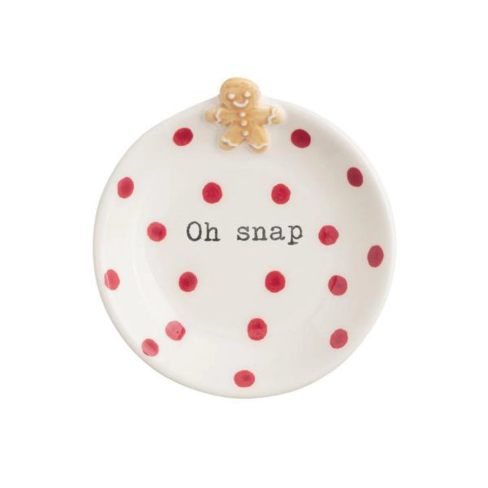 Round ceramic ornament with red polka dots and a gingerbread man on top, featuring the text 'Oh snap' on a white background.