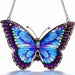 Bridgeton Hall Morpho Butterfly stained-glass-style suncatcher measuring 5.75 by 4.25 inches, featuring vibrant blue butterfly wings hanging in a sunny window.