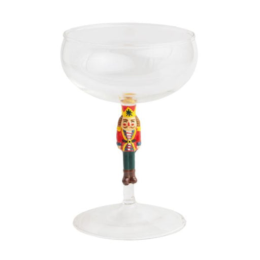 Decorative wine glass with a nutcracker handle on a white background