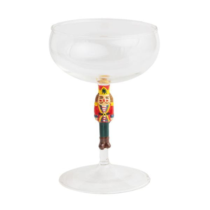 Decorative wine glass with a nutcracker handle on a white background