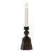 Decorative candle holder with a white candle on a white background