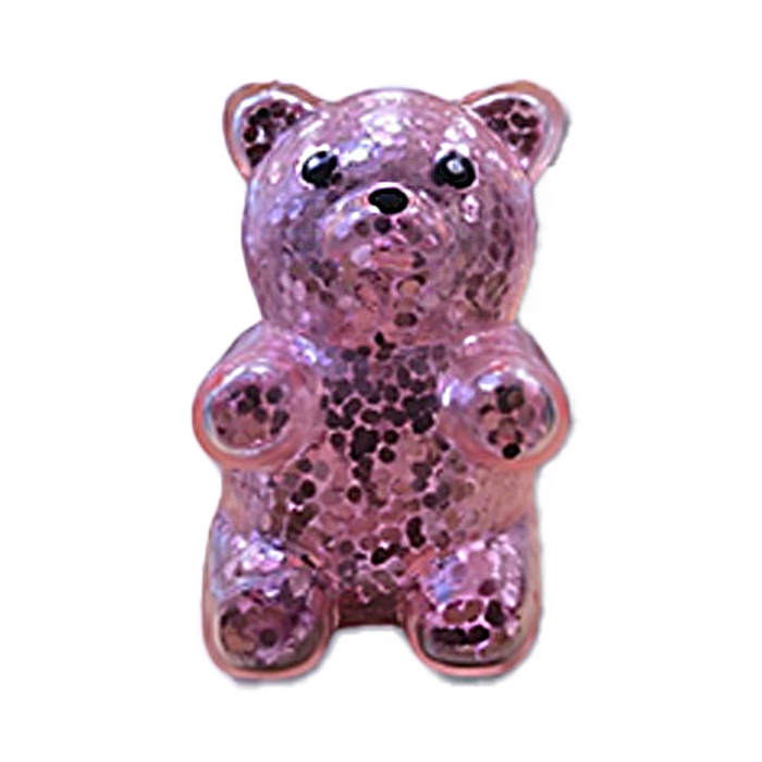 Pink glittery bear-shaped object on a white background