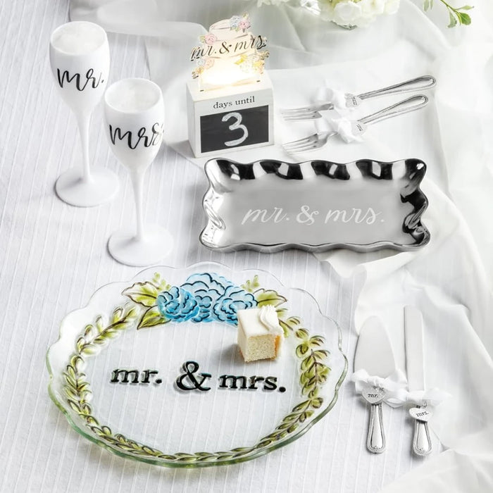 Wedding cake and knife set adorned with "We Tied the Knot," symbolizing love and commitment on the special day.