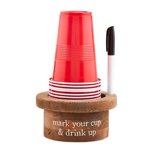 Wooden cup holder with red and white cups and a marker on a white background