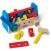 A wooden toolbox filled with various tools and colorful toys, showcasing a blend of functionality and playfulness.
