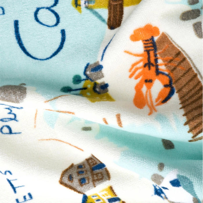 Spartina 449 Northeastern Harbors towel displayed on sandy beach setting