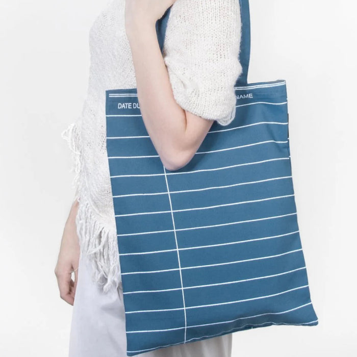 This Inked Blue Library Card Tote Bag is a stylish and functional accessory for book lovers, readers, and library enthusiasts.