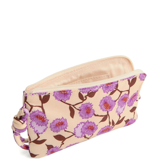 Front view of Vera Bradley Zip Wristlet in Stripey Buttons pattern, featuring purple and pink flowers on a beige nylon background with knotted wrist strap