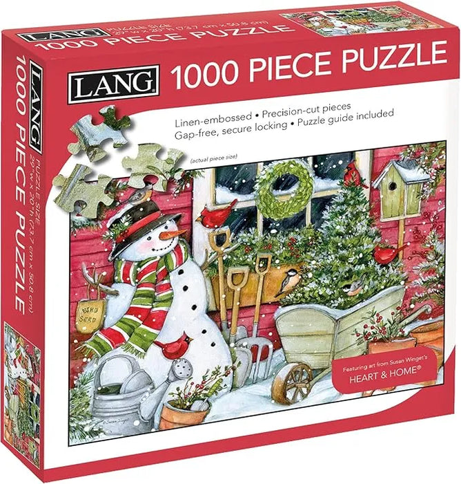 Box of a 1000 piece puzzle featuring a snowman and winter scene, with LANG branding.