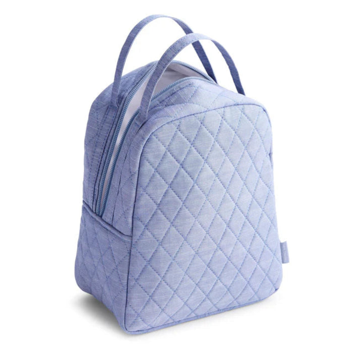  A blue quilted backpack equipped with a zipper, ideal for everyday use and travel.