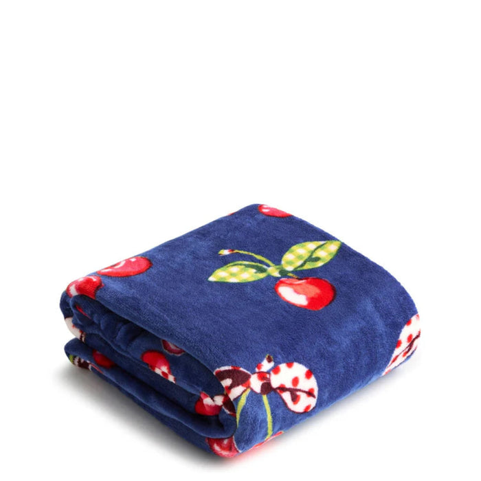 Vera Bradley Cherry Picking plush throw blanket with vibrant cherry pattern and soft polyester fabric for year-round warmth.