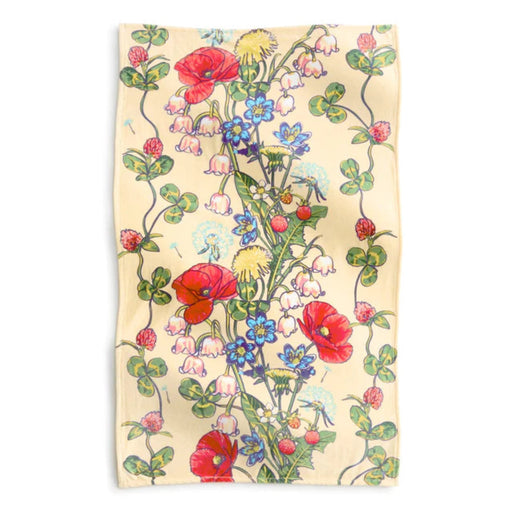 A vibrant floral pattern featuring red, blue, and yellow flowers against a light background.